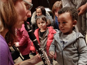 Robbie Neal (right) is all eyes and ears listening to  Laurence Neill-Poirier at the Bach Before Bedtime concert in March.