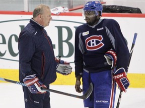 Canadiens coach Michel Therrien talks with defenceman P.K. Subban during practice at the Bell Sports Complex in Brossard on March 13, 2015.