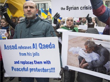 Demonstrators in Montreal march on the fourth anniversary of the start of uprising against the Syrian government and are calling for democracy for the people of Syria on Saturday, March 15, 2014.