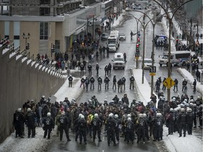 Police block marchers protesting against police brutality on Berri St. on Sunday.