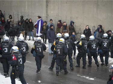Police stop protesters Opposed to Police Brutality from marching on Berri St. in Montreal, on Sunday, March 15, 2015.