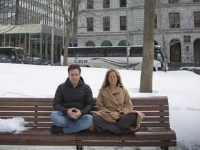 Garner Bornstein and Lynne Goldberg meditate in Dorchester Square on Tuesday, March 17, 2015.  They are co-founders of OMG I Can Meditate, a meditation app.