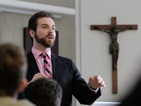 John Patrick Mancini teaches a religion class at Loyola High School in Montreal Wednesday, March 18, 2015.  The Supreme Court of Canada is expected to hand down its decision Thursday morning on Loyola's challenge to Quebec's mandatory ethics and religious culture course taught in the province's high schools. The school currently teaches what it feels is an equivalent.