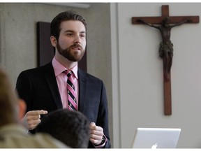 John Patrick Mancini teaching a religion class  at Loyola High School on Wednesday, the day before the Supreme Court of Canada handed down its decision on the private Catholic school's challenge to Quebec's mandatory ethics and religious culture course. The school currently teaches what it believes is an equivalent course.