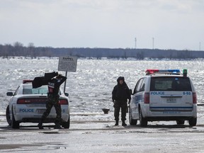 Police at the scene where a man fell through the ice in Lac St-Louis near the corner of St-Joseph boulevard and 34e avenue in Lachine on Wednesday, March 18, 2015.