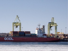 MONTREAL, QUE.: MARCH 19, 2015 --  A container ship is loaded at the port of Montreal on Thursday, March 19, 2015. (Peter McCabe / MONTREAL GAZETTE)