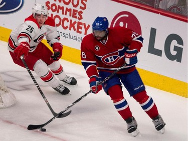 Carolina Hurricanes left wing Chris Terry fails to strip the puck from Montreal Canadiens defenseman P.K. Subban at the Bell Centre on Thursday, March 19, 2015.