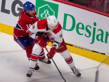 Montreal Canadiens centre Tomas Plekanec ties up Carolina Hurricanes right wing Andrej Nestrasil at the Bell Centre on Thursday, March 19, 2015.