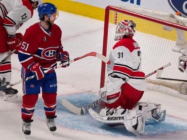 Montreal Canadiens centre David Desharnais in front of Carolina Hurricanes goalie Anton Khudobin after scoring the Canadiens' third goal at the Bell Centre on Thursday, March 19, 2015.