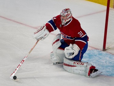 Montreal Canadiens goalie Carey Price pulls in a loose puck at the Bell Centre on Thursday, March 19, 2015.