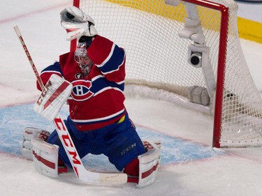 Montreal Canadiens goalie Carey Price makes a glove save against the Carolina Hurricanes at the Bell Centre on Thursday, March 19, 2015.