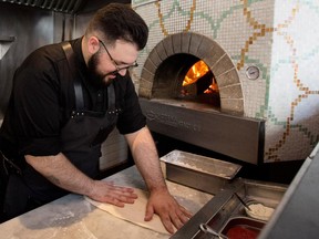 Gian Paolo De Riggi makes a porchetta pizza, which will feature roast pork, a few dabs of salsa verde and a topping or fresh arugula.