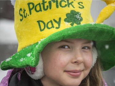 MONTREAL, QUE.: Eight-year-old Teagan McKinnon of St-Lazare gives a sly smile while waiting for the 6th annual St. Patrick's Day parade in Hudson on Saturday, March 21, 2015.