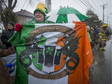 Frank Fitzgerald proudly holds his personal flag at the 6th annual St. Patrick's Day parade in Hudson, on Saturday, March 21, 2015.