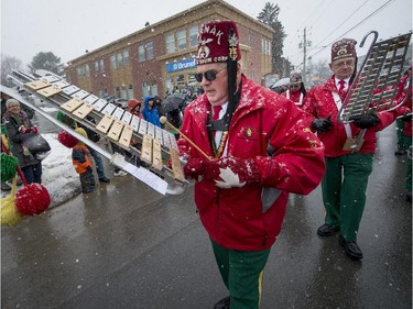 Musicians with the Karnak Shriners perform while marching.