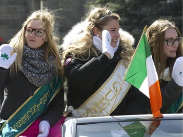 A parade queen, centre, and princesses participate in the annual St. Patrick's parade along Ste- Catherine St. in Montreal on Sunday March 22, 2015.