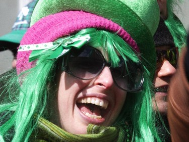 Amira Kelner applauds during the annual St. Patrick's parade along Ste- Catherine St. in Montreal on Sunday March 22, 2015.