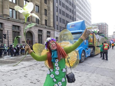 Edna-May MacKenzie dances during the annual St. Patrick's parade along Ste- Catherine St. in Montreal on Sunday March 22, 2015.