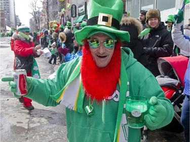 Eugene Francis Sloan dances during the annual St. Patrick's parade along Ste- Catherine St. in Montreal on Sunday March 22, 2015.