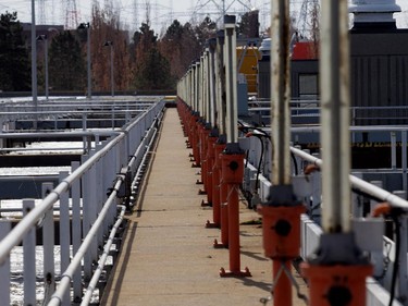 A long bank of valve and pumps control the flow of water between grit removal tanks at the Montreal sewage treatment facility in Montreal on Monday March 23, 2015.