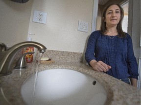 Andrea Satin has to keep the water running in her bathroom 24 hours a day so the pipes leading to her home in Dollard-des-Ormeaux won't freeze up for a third time, on Monday, March 23, 2015. The first time Dollard public works crews thawed the pipe for free. The second time, she received  a $620 bill.