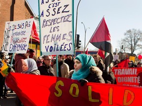 A group gathers to protest against a planned PEGIDA anti-Islam march in Montreal on Saturday March 28, 2015. The PEGIDA protest did not come to fruition as police escorted a handful of PEGIDA protestors off the site.