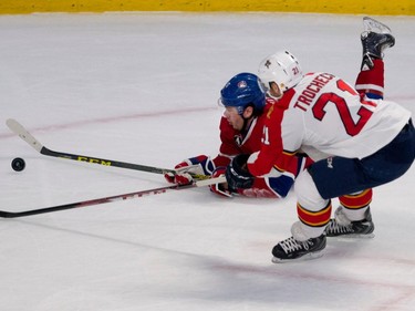 Florida Panthers centre Vincent Trocheck, right, sends Montreal Canadiens right wing P.A. Parenteau to the ice during NHL action at the Bell Centre in Montreal on Saturday March 28, 2015.