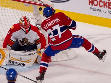 Canadiens centre Alex Galchenyuk, right, scores against Florida Panthers goalie Roberto Luongo during NHL action at the Bell Centre in Montreal on Saturday March 28, 2015.
