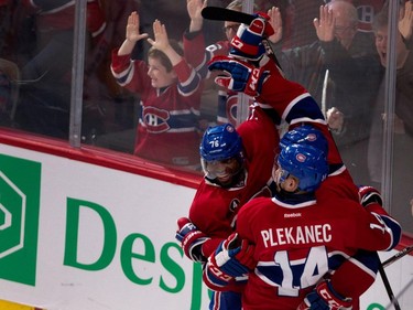 Canadiens defenceman P.K. Subban, left, celebrates with Montreal Canadiens centre Alex Galchenyuk, centre, and Montreal Canadiens centre Tomas Plekanec after Galchenyuk scored the tying goal against Florida Panthers goalie Roberto Luongo during NHL action at the Bell Centre in Montreal on Saturday March 28, 2015.