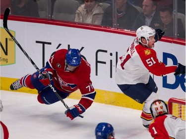 Canadiens defenceman P.K. Subban has his legs clipped out from under him by Florida Panthers defenceman Brian Campbell during NHL action at the Bell Centre in Montreal on Saturday March 28, 2015. (Allen McInnis / MONTREAL GAZETTE)