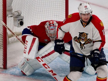 Canadiens goalie Carey Price strains to see the play as Florida Panthers centre Aleksander Barkov blocks the net during NHL action at the Bell Centre in Montreal on Saturday March 28, 2015.