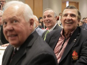 Former Canadiens greats (front to back) Yvan Cournoyer, Serge Savard and Guy Lafleur enjoy the Sports Celebrity Breakfast at the Cummings Centre in Montreal  on Sunday, March 29, 2015.