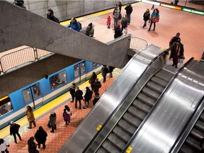 STM customers wait at the Lionel-Groulx métro station in Montreal on Tuesday March 3, 2015.