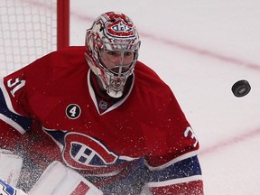 Montreal Canadiens goalie Carey Price follows flying puck during second-period action in Montreal on Monday, March 30, 2015.