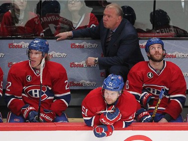 Montreal Canadiens' coach Michel Therrien and players Dale Weise, David Desharnais and Brandon Prust during the last seconds of game against the Tampa Bay Lightning in the third period in Montreal on Monday, March 30, 2015.