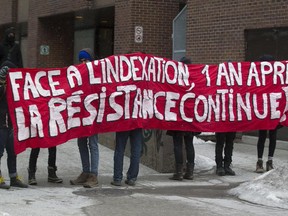 Protesters block one of the entrances to Université du Québec à Montréal (UQAM) in Montreal, Monday March 30, 2015, to protest against the Quebec government's austerity measures, and the planned expulsion of nine students at the university. Students, union members and teachers are expected to hit the streets today in what is expected to be the biggest protest thus far in 2015.