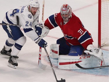 Tampa Bay Lightning's Ryan Callahan tries to put puck past Montreal Canadiens goalie Carey Price during third period in Montreal on Monday, March 30, 2015.
