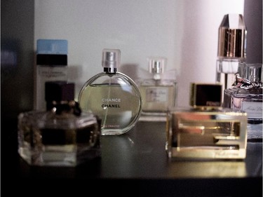 French perfume sits on a bookshelf.