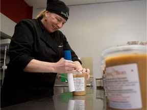 Caroline Ross wraps containers of split pea soup at Bon C Bon in LaSalle on Saturday March 7, 2015.