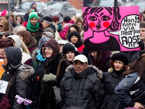 Participants march along De Maisonneuve street during a march to mark International Women's Day in Montreal on Sunday March 8, 2015.