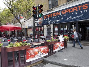 A sidewalk terrasse outside Station des Sports Restaurant and Bar on Ste-Catherine St.