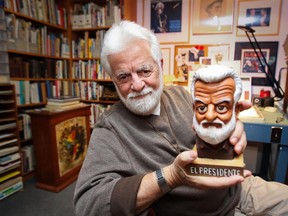 Terry Mosher, aka Aislin, with a bust of himself created by Quebec City cartoonist Christian Daigle, aka Fleg, Sept. 30, 2014.