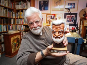 MONTREAL, QUE.: SEPTEMBER 30, 2014 -- Terry Mosher, aka Aislin, with a bust of himself created by Quebec City cartoonist Christian Daigle, aka Fleg, to mark Mosher's heading the Canadian Association of Editorial Cartoonists from 2009 to 2012, at his home in Lachine, west of Montreal Tuesday September 30, 2014.  (John Mahoney  / THE GAZETTE) ORG XMIT: 51097-0482