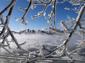 Ice fog from the St. Lawrence river blankets Montreal as wind chill temperatures hit -38 C Wednesday, January 23, 2013 in Montreal.