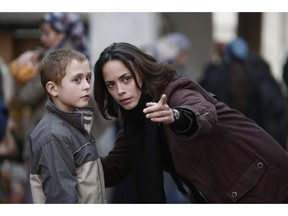 Carole (Bérénice Bejo) takes Hadji (Abdul Khalim Mamutsiev) under her wing in The Search.