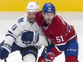 The Canadiens' David Desharnais and the Toronto Maple Leafs' Olli Jokinen battle for position during game at the Bell Centre on Feb. 28, 2015. The Canadiens won 4-0.