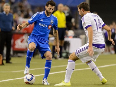 Ignacio Piatti #10 of Montreal Impact tries to play the ball past Luke Boden #14 of Orlando City SC during the MLS game at the Olympic Stadium on March 28, 2015, in Montreal.