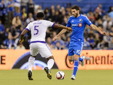 Ignacio Piatti #10 of Montreal Impact looks to play the ball past Amobi Okugo #5 of Orlando City SC during the MLS game at the Olympic Stadium on March 28, 2015, in Montreal.
