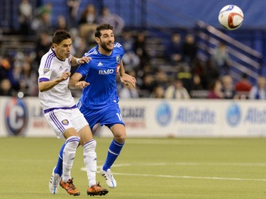 Eric Avila #12 of Orlando City SC and Ignacio Piatti #10 of Montreal Impact chase the ball during the MLS game at the Olympic Stadium on March 28, 2015, in Montreal, Quebec, Canada.  The game between Orlando City SC and the Montreal Impact ended in a 2-2 draw.