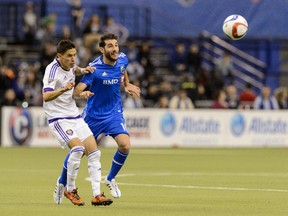 MONTREAL, QC - MARCH 28:  Eric Avila #12 of Orlando City SC and Ignacio Piatti #10 of Montreal Impact chase the ball during the MLS game at the Olympic Stadium on March 28, 2015 in Montreal, Quebec, Canada.  The game between Orlando City SC and the Montreal Impact ended in a 2-2 draw.